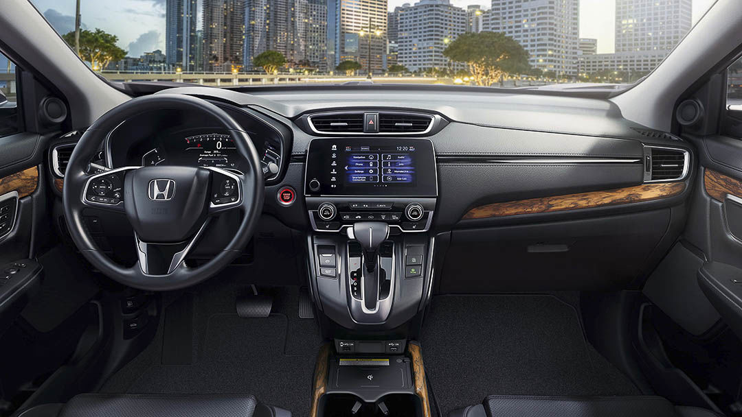 view of the steering wheel and central dashboard inside of the 2021 Honda CR-V
