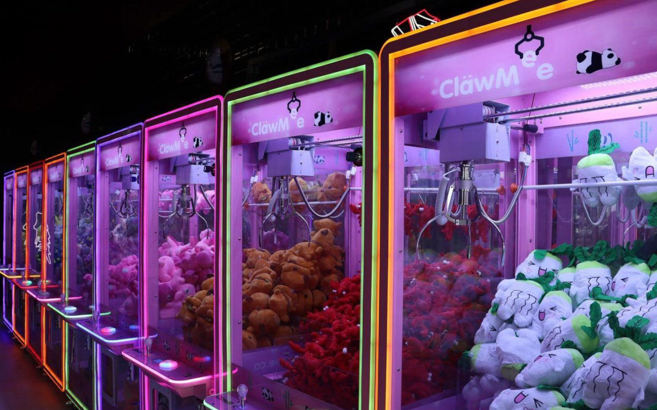 a row of claw machines at Clawville Laval