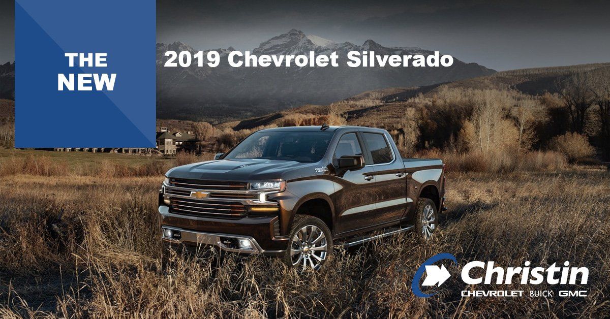 Image of the new 2019 chevrolet silver posinf in front of a landscape in the mountains