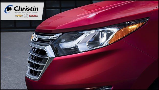 Image of the front of the 2018 Chevrolet Equinox in red color. Christin's logo in the upper left corner
