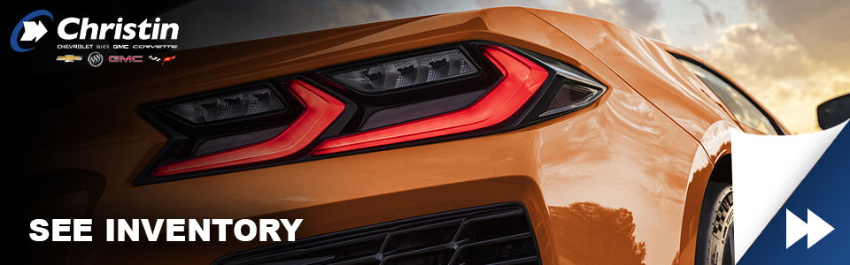 sports car chevrolet corvette z06 muscle car orange color rear headlights view with christin automobiles logo