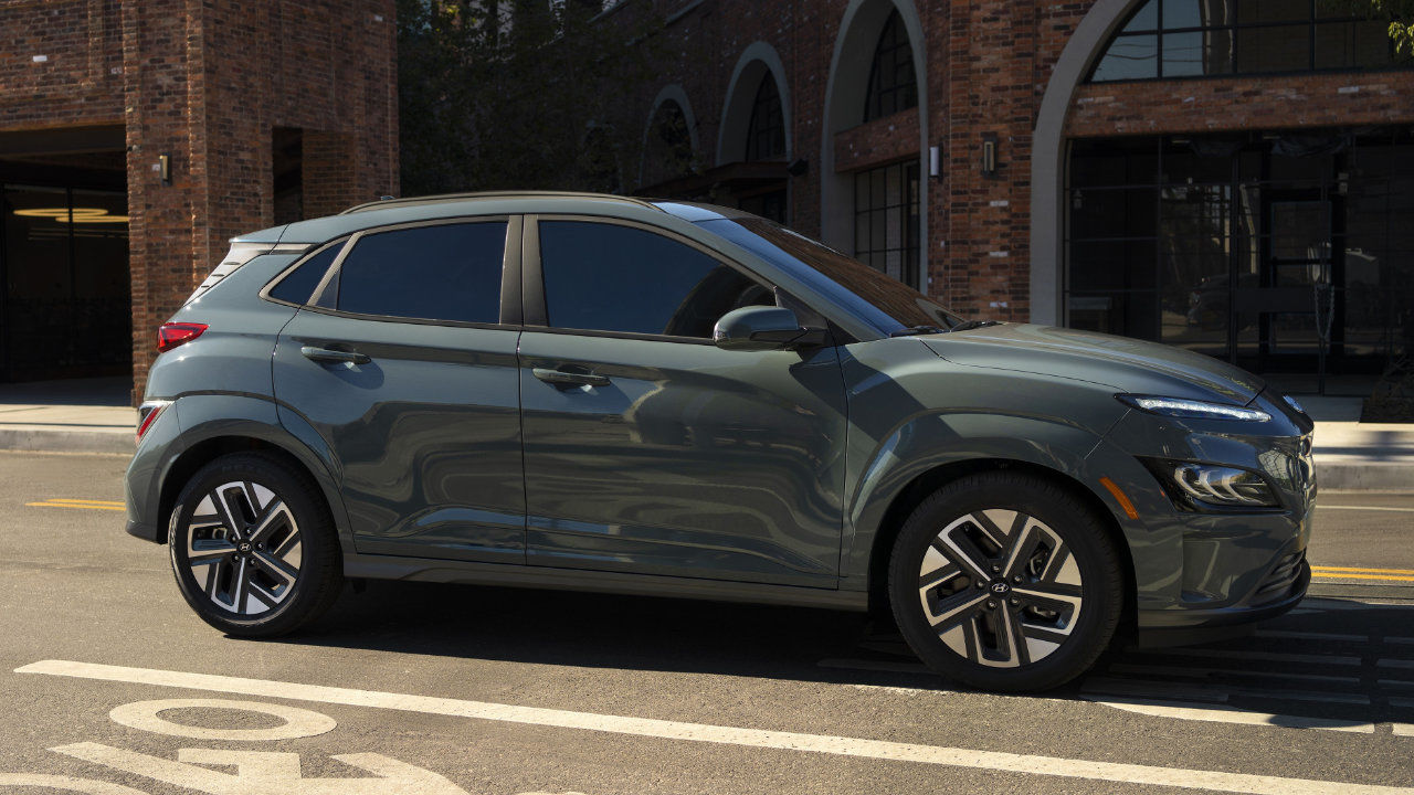 side view of a 2023 Hyundai Kona 2023 in town