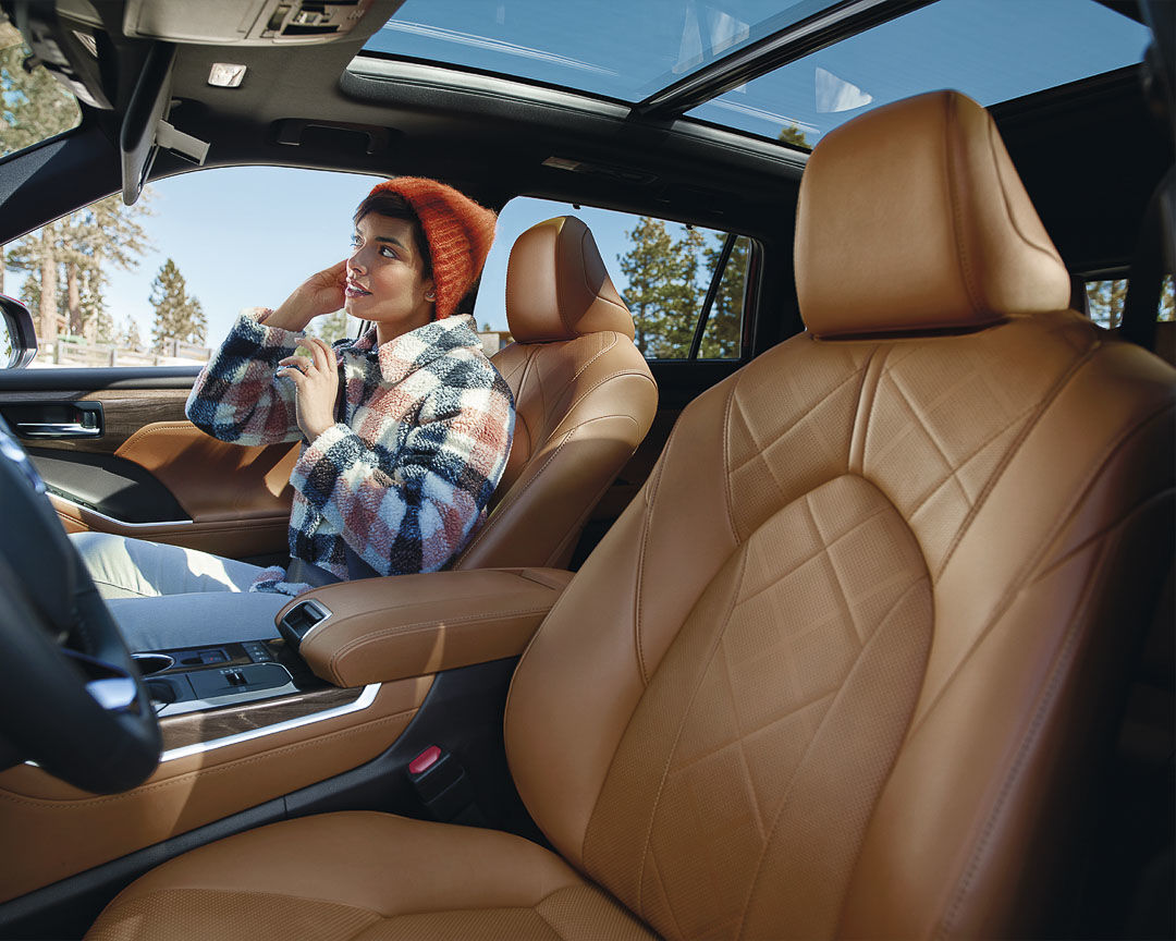 view of the driver seat and panoramic sunroof of the 2022 Toyota Highlander