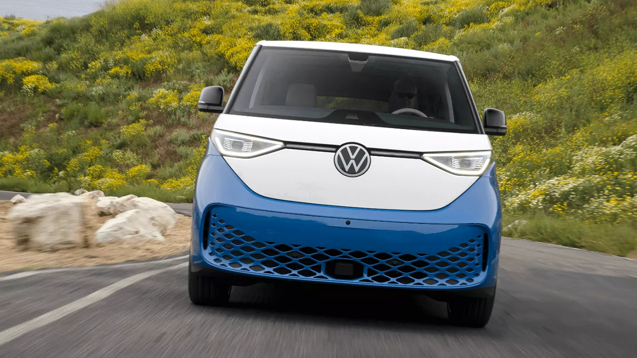 Front view of the Volkswagen ID.Buzz AWD 2025 on the road at full power