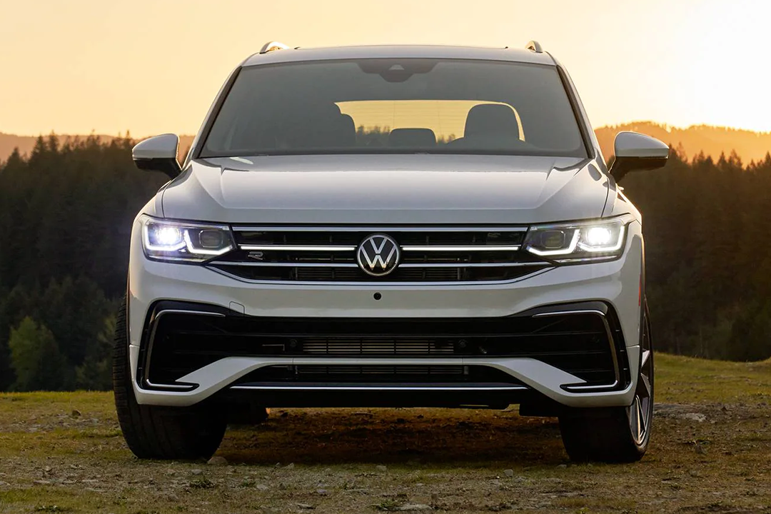 Front view of Volkswagen Tiguan 2023 on hill with sunset