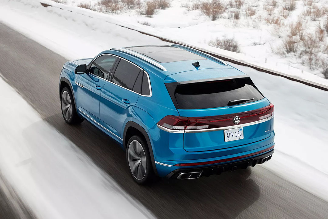 Rear view of the Volkswagen Atlas Cross Sport 2024 on snow-covered roads