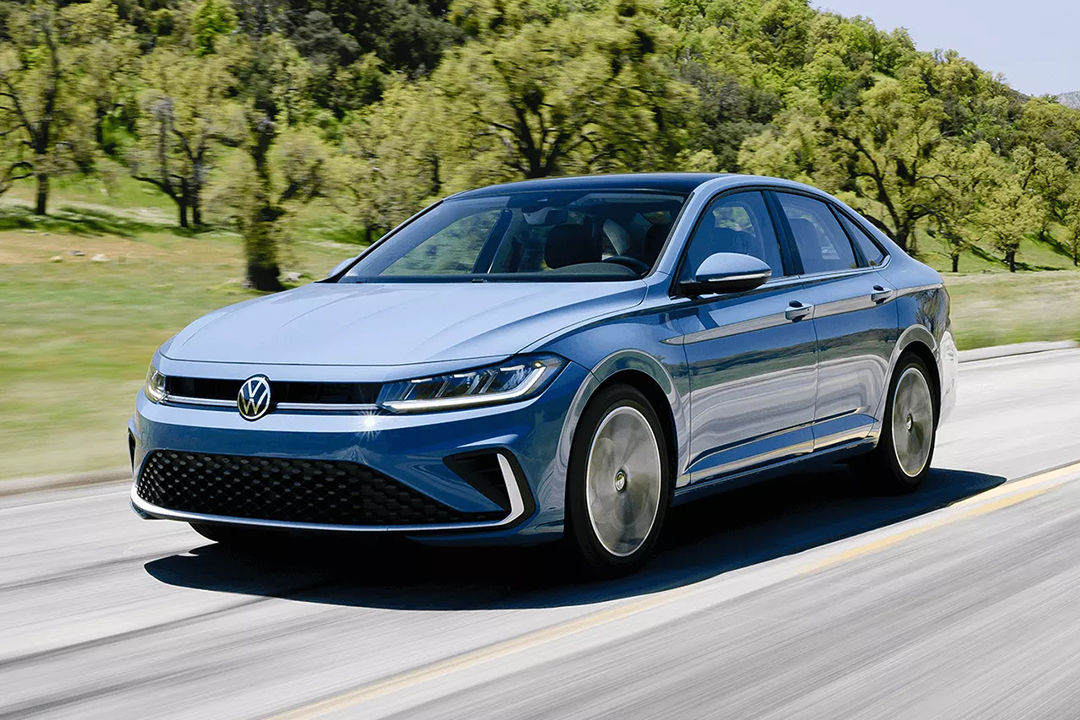 Front 3/4 view of the Volkswagen Jetta 2025 on the road at full power