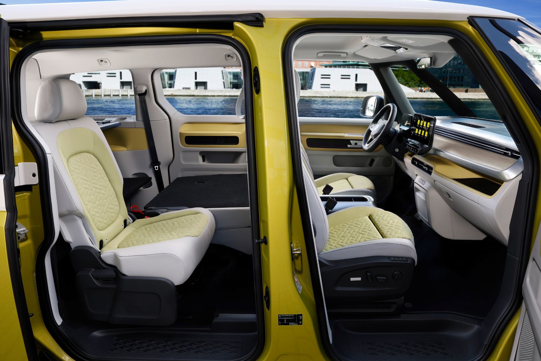 The modular interior of an electric VW Westfalia, including its large rear bench seat