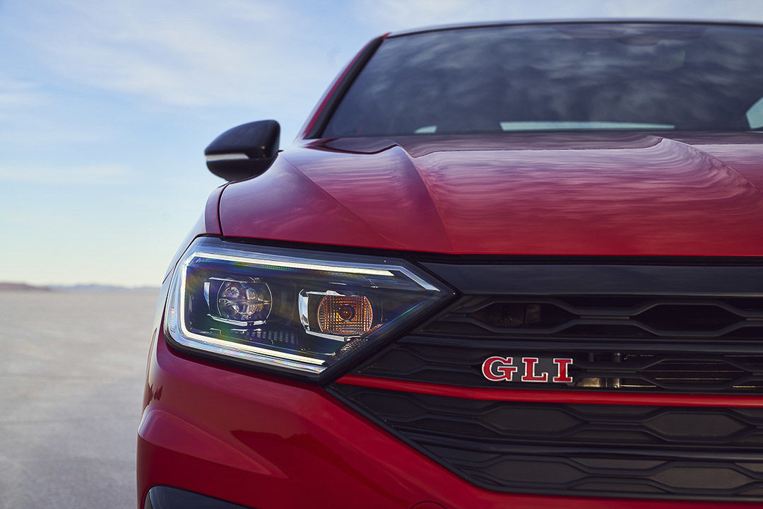 close up front view of the 2021 Volkswagen Jetta GLI with the headlight and 'GLI' badge