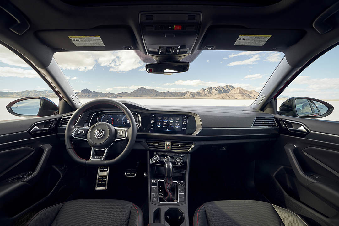 view of the central dashboard and steering wheel inside of the 2021 Volkswagen Jetta GLI