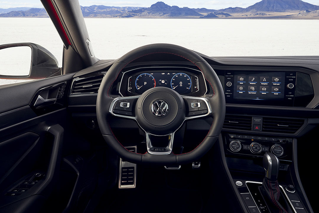 close up shot of the steering wheel inside of the 2021 Volkswagen Jetta GLI