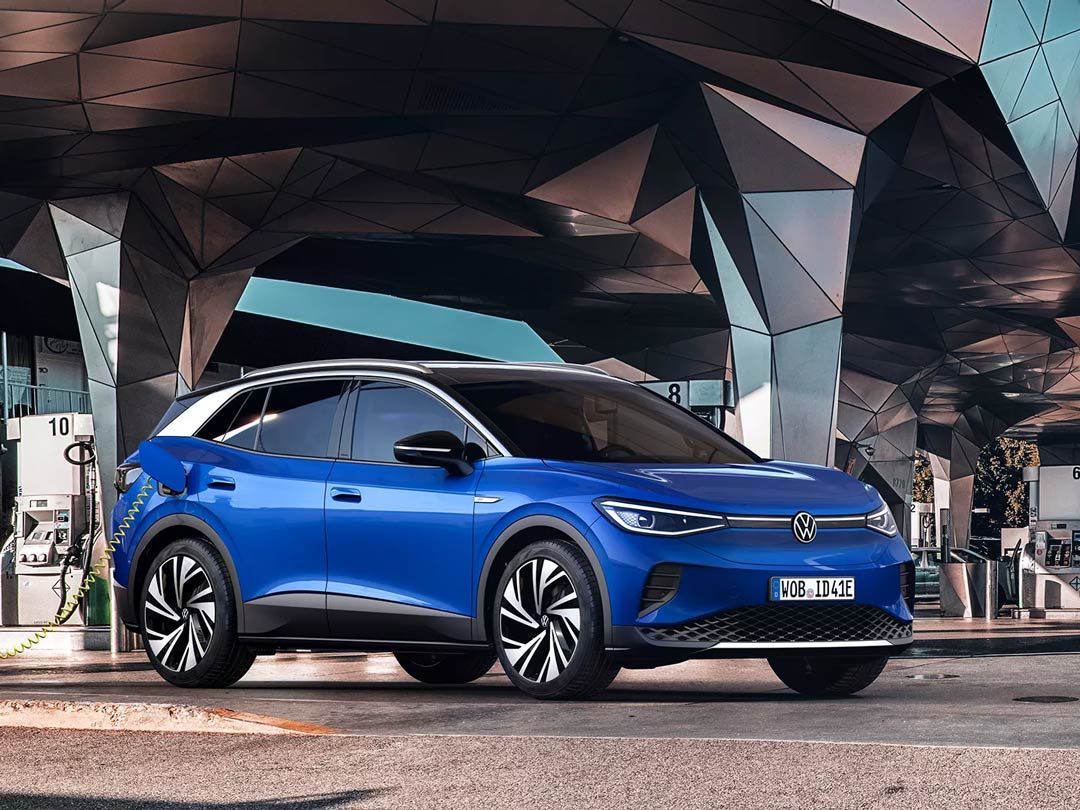 lateral front view of the 2021 Volkswagen ID.4 plugged into a charging station
