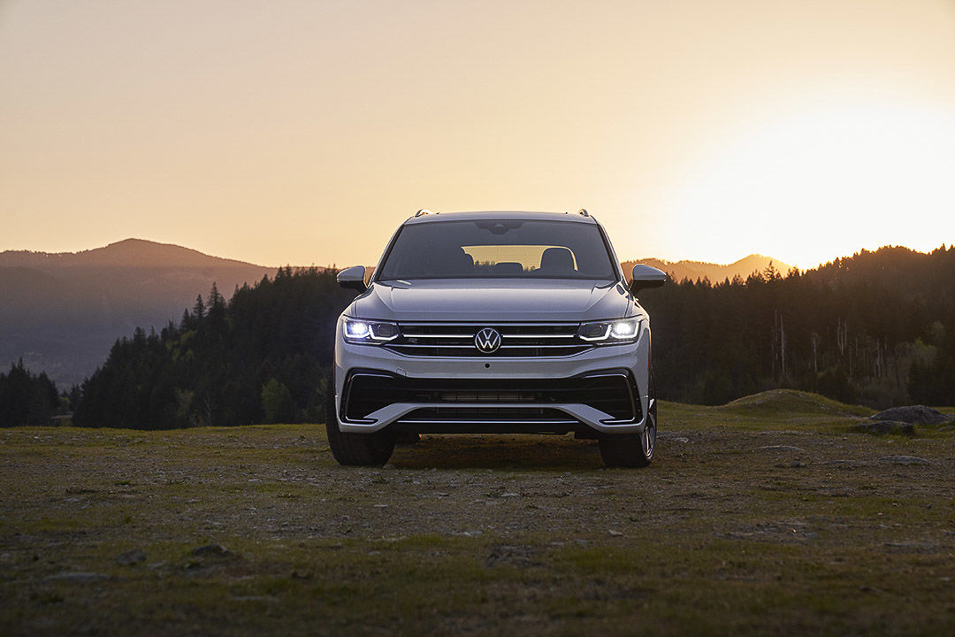 front view of the 2022 Volkswagen Tiguan with the headlights turned on