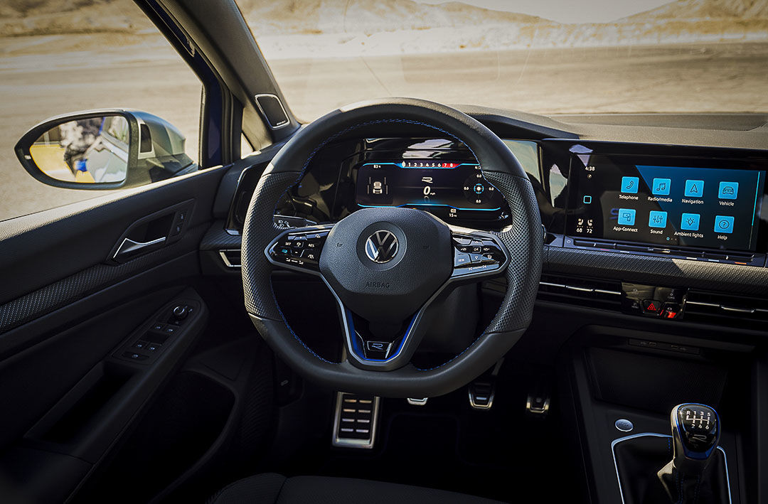 close up front view of the steering wheel and dashboard of the 2022 Volkswagen Golf R