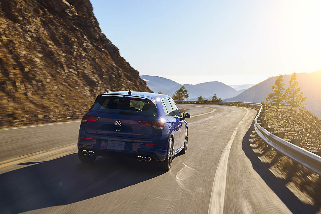rear view of the 2022 Volkswagen Golf R driving down a road