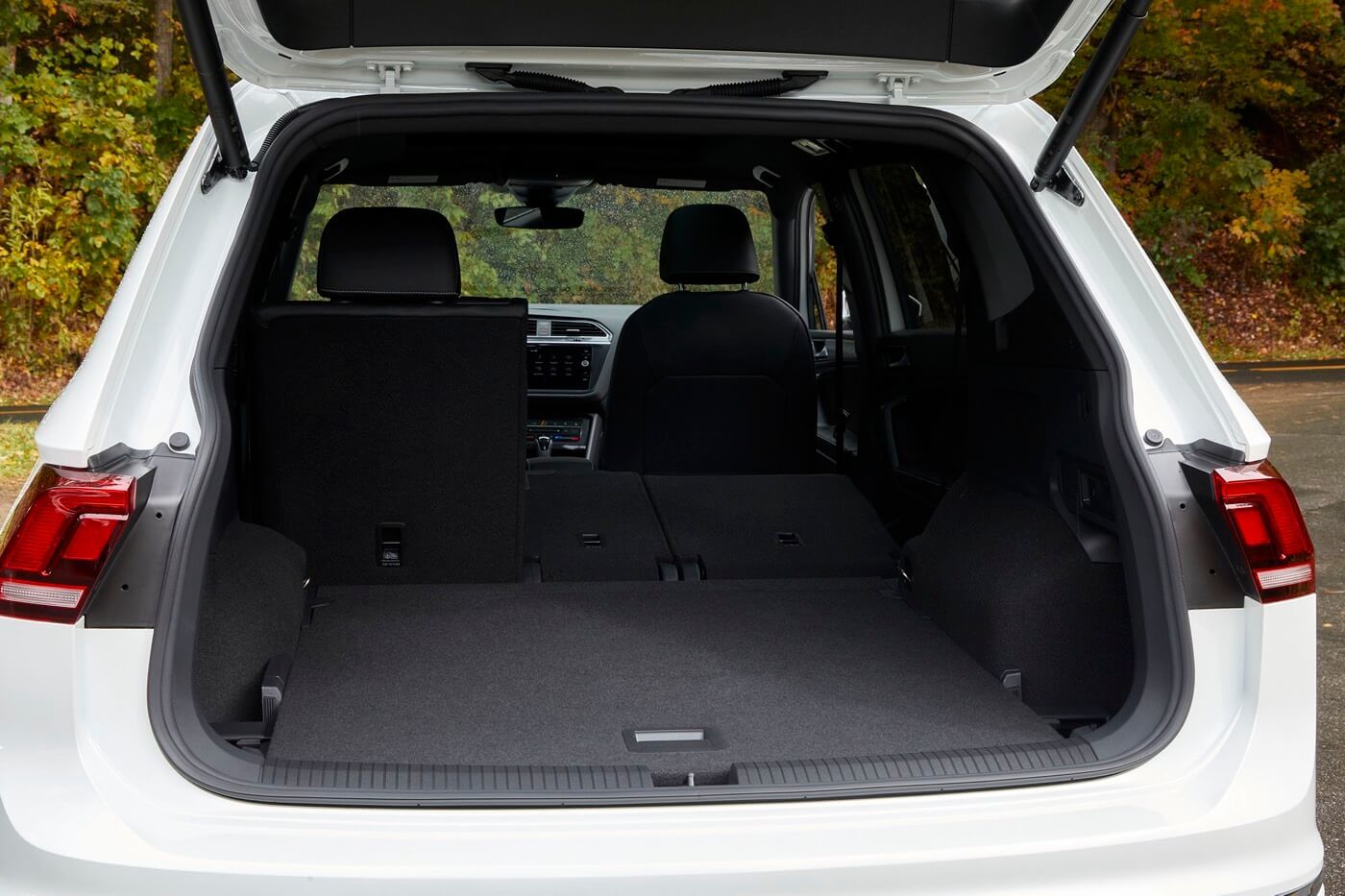 rear view of the 2022 Volkswagen Tiguan with the trunk door open and the rear row seats pushed down