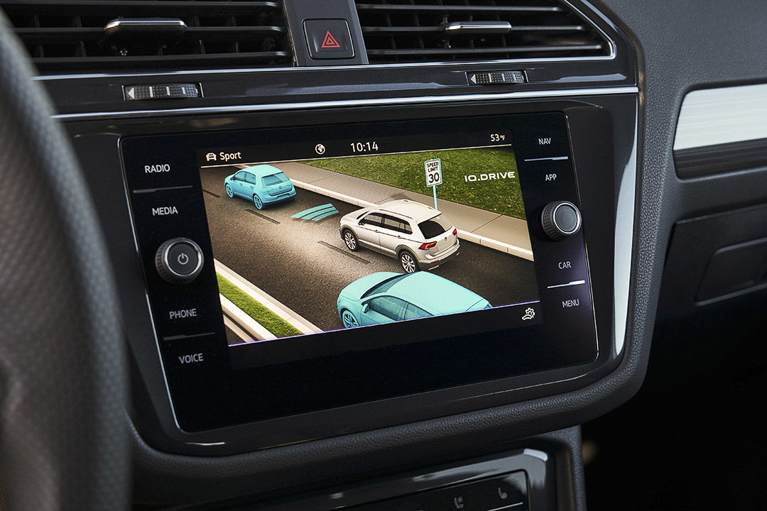 view of the touchscreen and of the traffic monitoring system inside of the 2022 Volkswagen Tiguan R-Line