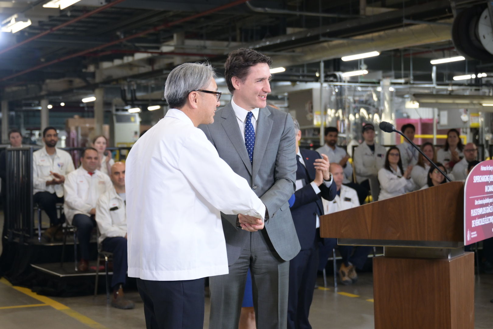 Toshihiro Mibe, President and CEO of Honda Motor Co., shakes hands with The Right Honourable Justin Trudeau, Prime Minister of Canada at Honda of Canada Mfg., where the company announced a $15-billion investment to build a comprehensive electric vehicle value chain in Canada.