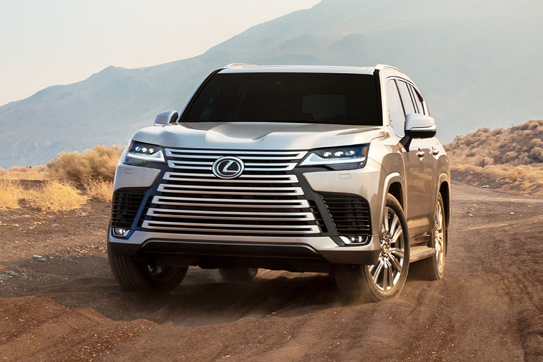 Front view of the Lexus LX 2024 on a sandy road