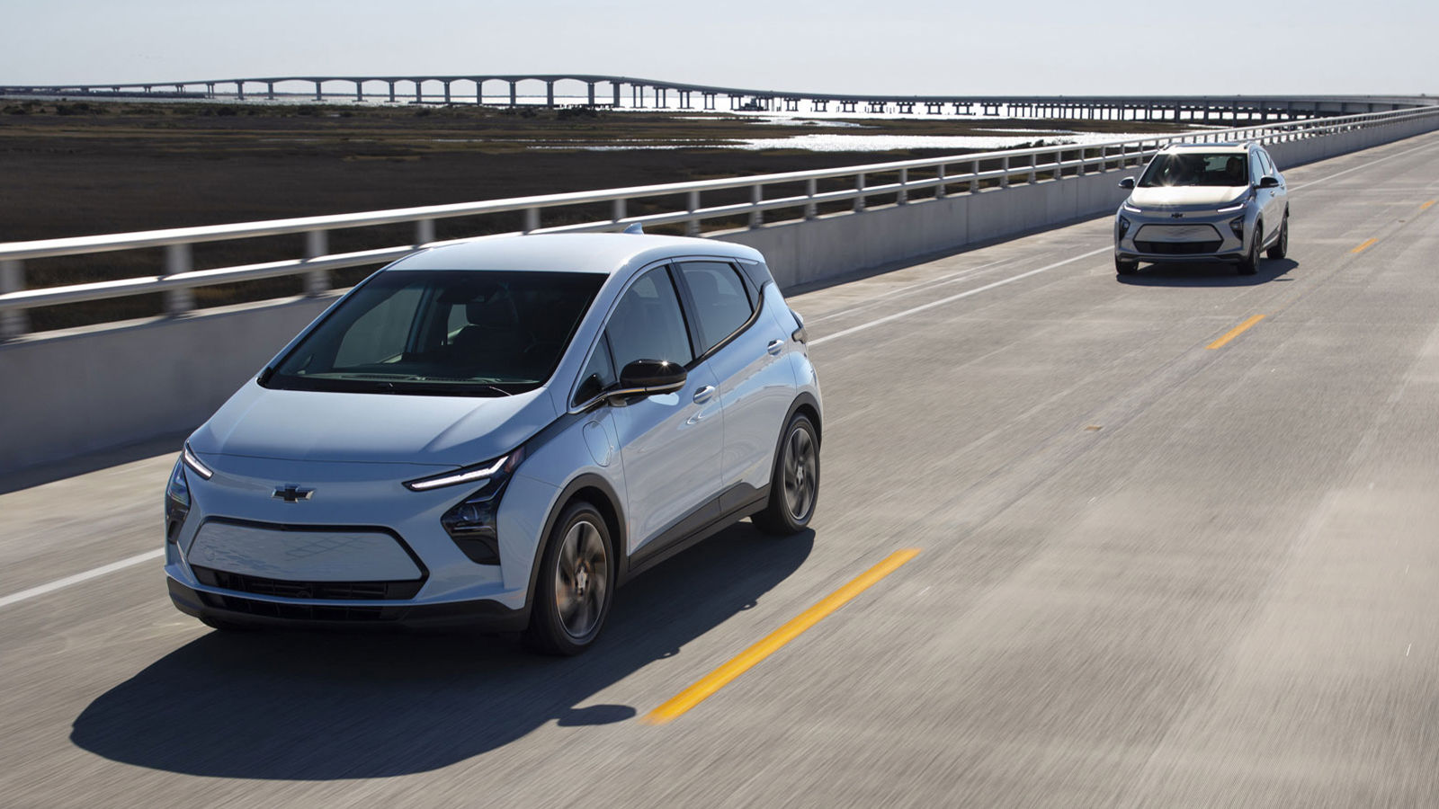 2023 chevrolet bolt ev euv white grey electric on road with bridge highway in montreal east