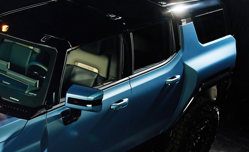 2024 GMC Hummer EV Omega. blue. electric. SUV. performance. luxury. off-road. innovations. technology. battery. autonomy. design. futuristic. comfort. safety. price. specifications. features.