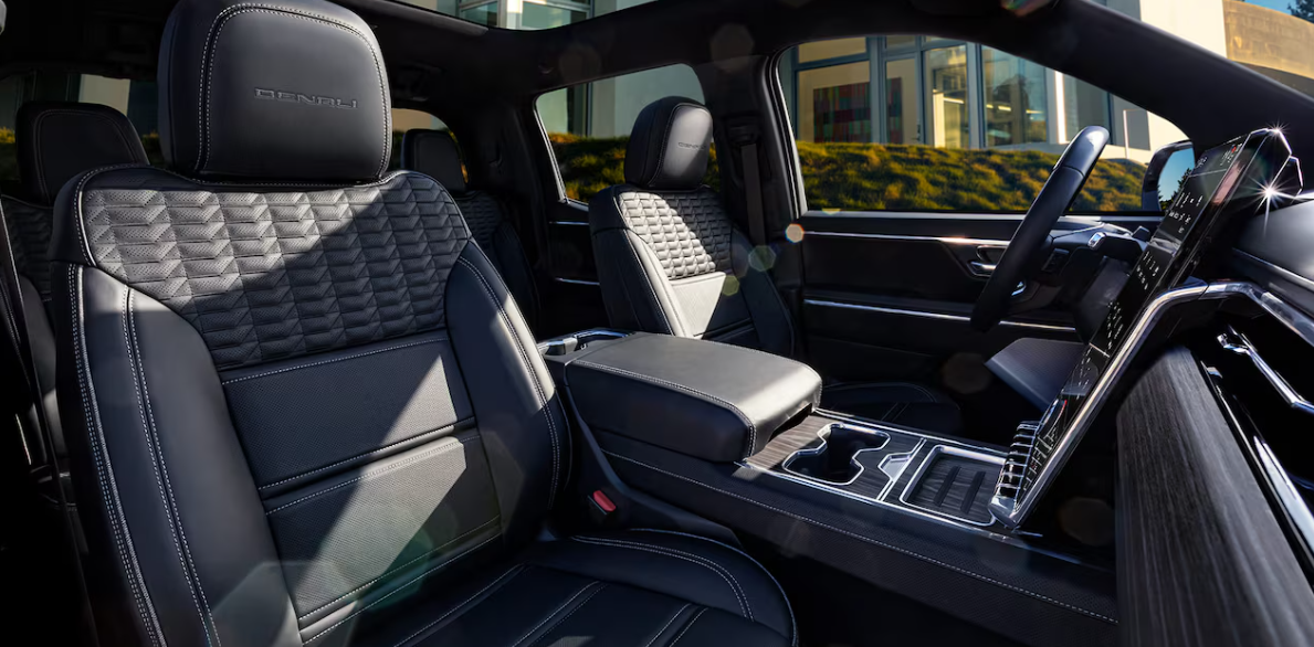 refined cabin. large touchscreen display. premium leather seats. spacious interior. heated and ventilated seats. digital dashboard. modern design. intuitive controls. premium finishes. ambient lighting. heated steering wheel. integrated technology. sustainable materials. quiet ride. high-end comfort.