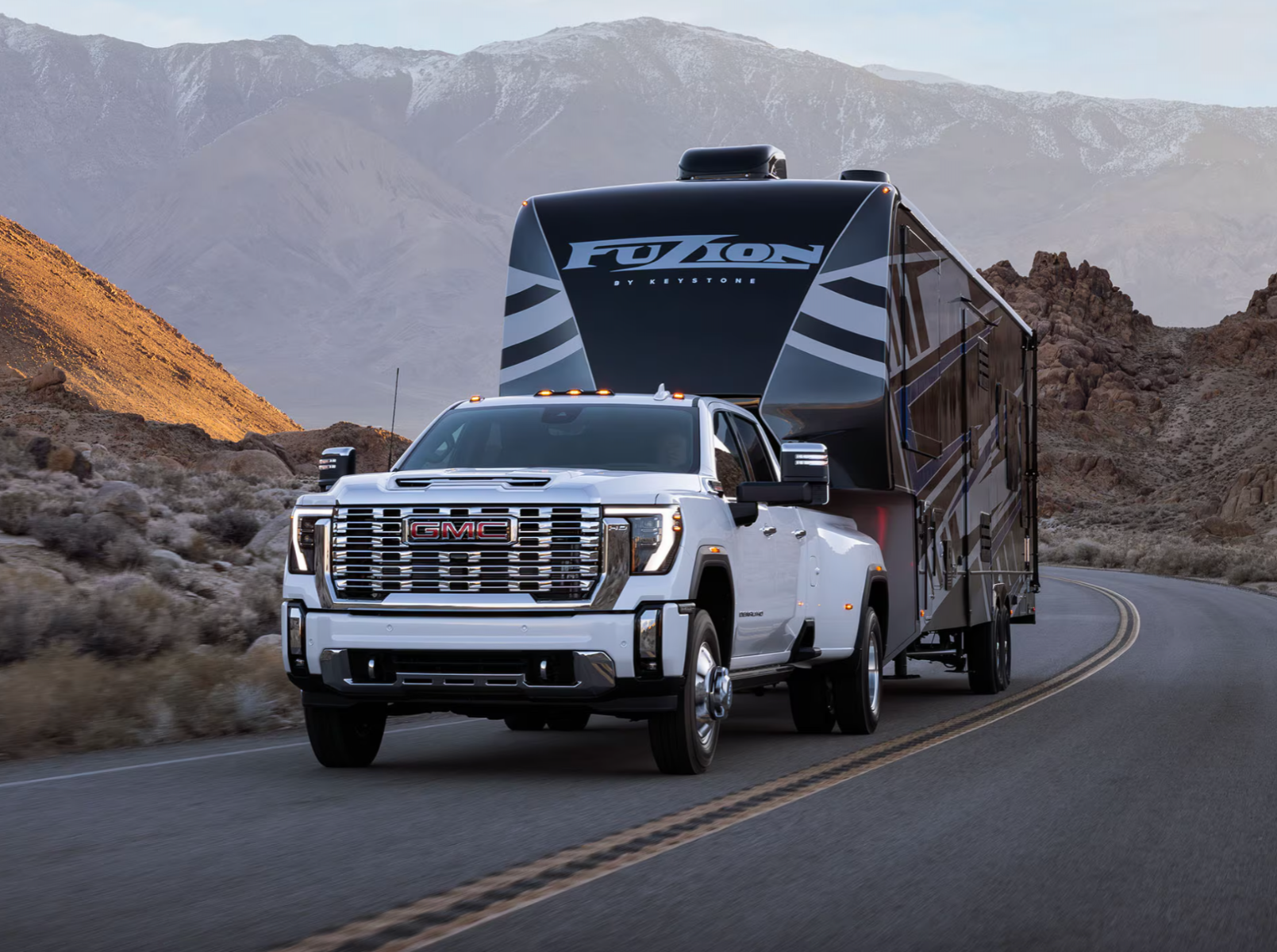White 2025 GMC Sierra 2500 HD towing.