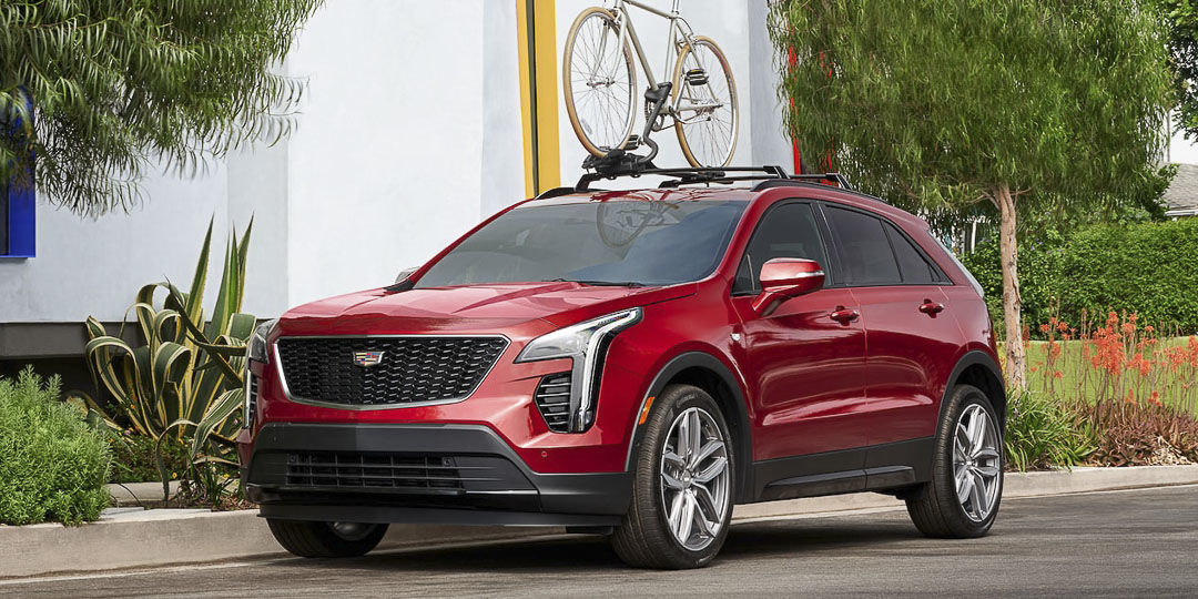 three quarter front view of the 2022 Cadillac XT4 parked on a city street
