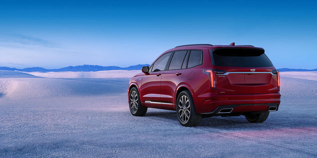 rear side view of a 2023 Cadillac XT6 in the desert