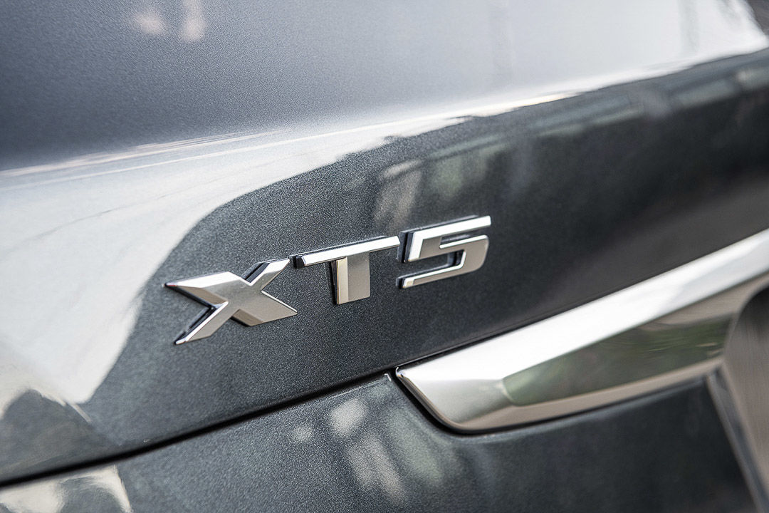 close up view of the model's badge on the Cadillac XT5