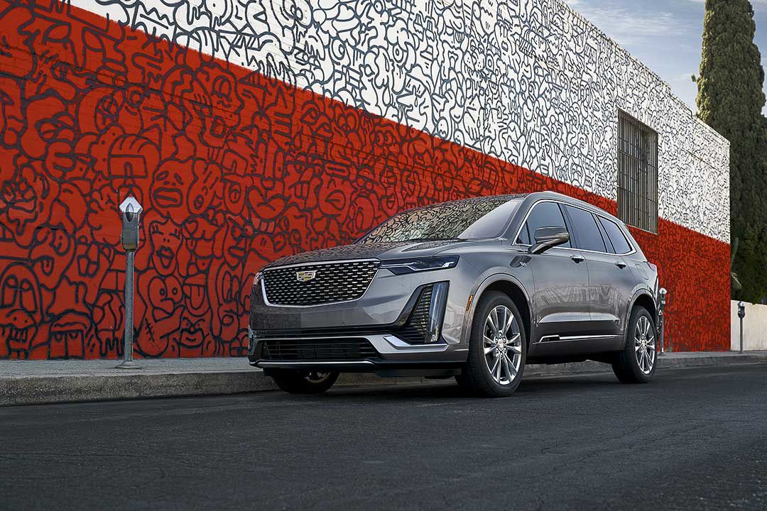 three quarter front view of the 2022 Cadillac XT6 parked on a city street