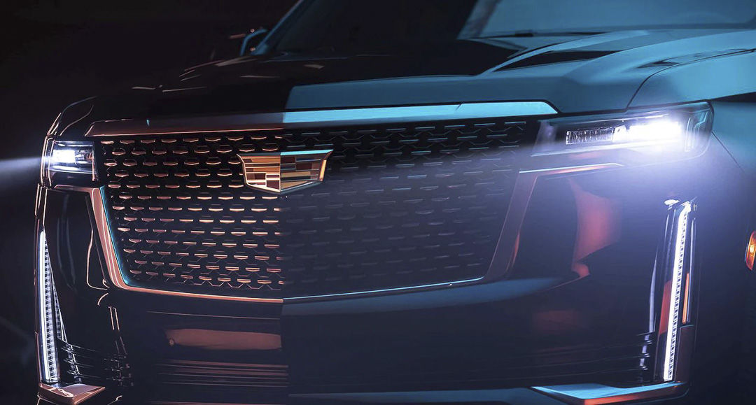 close up front view of the headlights and grille of the 2022 Cadillac Escalade