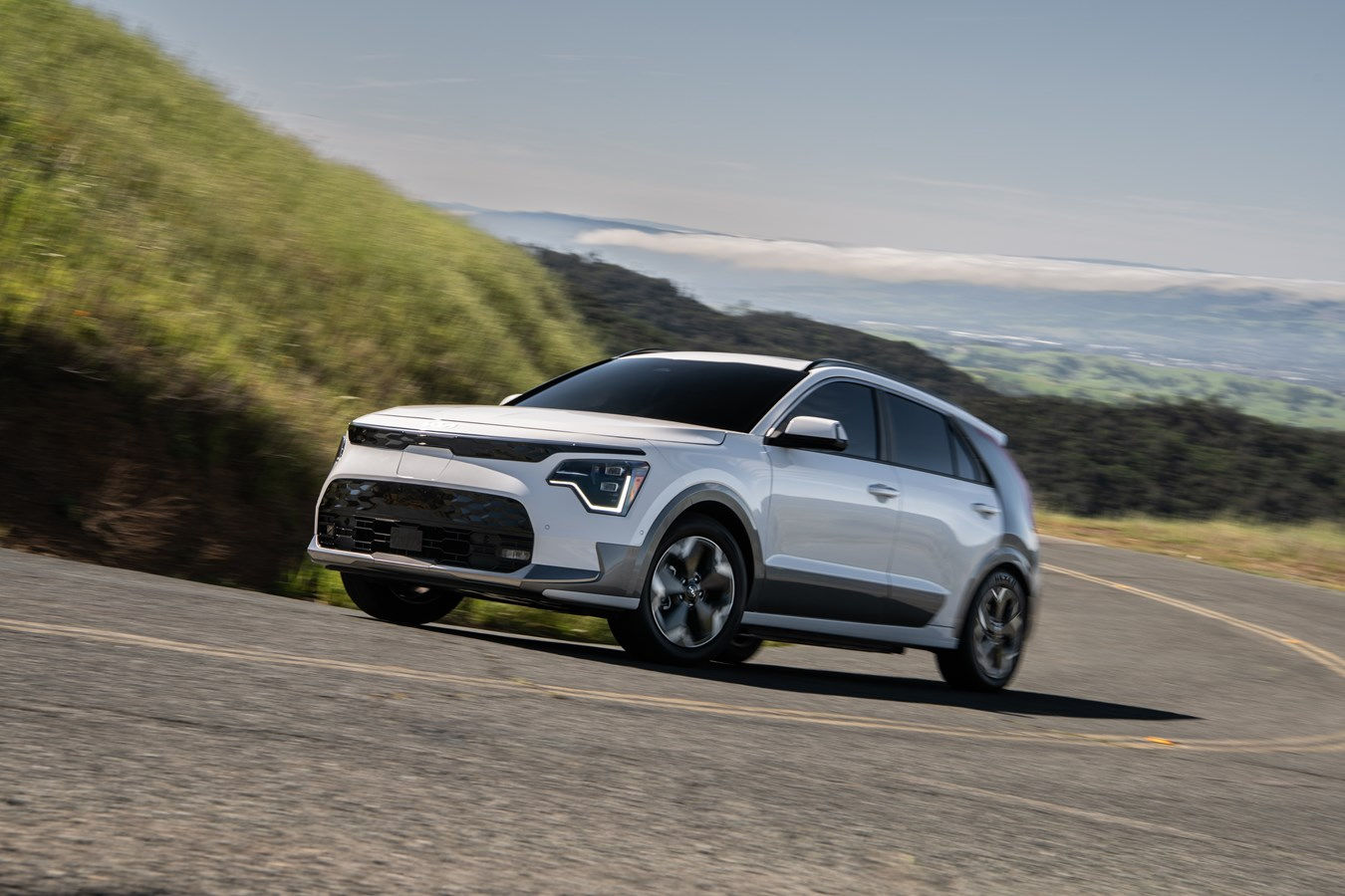 Front side view of the electric Kia Niro EV on the road in elevation