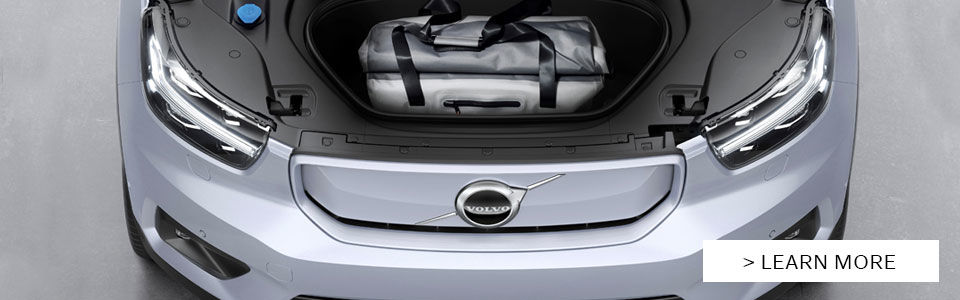 Image showing the trunk open with ample storage space located at the front of the vehicle, the electric car is a grey 2022 Volvo XC40 Recharge. 2022 Volvo XC40 Recharge. Electric Volvo Vehicle. Volvo West Island Dealership. XC40 Electric Performance. Volvo 2022 Innovation. Luxury Electric SUV. Volvo Electric Technology. Sustainable Volvo Driving. Scandinavian Design XC40. Volvo XC40 Electric Range. Volvo Driving Experience. Volvo XC40 Safety. Ecology and Volvo Cars. Volvo Recharge Connectivity. Volvo XC40 Recharge Testimonials.