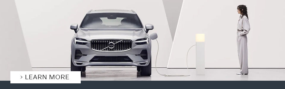 gray volvo XC60 recharge 2022 vehicle connected to an electric charging station