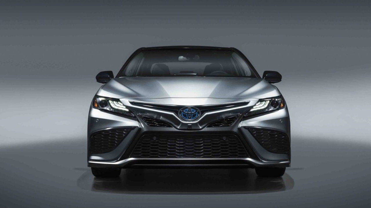 front view of a 2022 Toyota Camry in front of a gray background