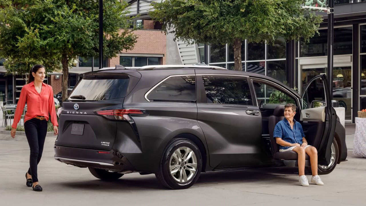 view of a family around a 2022 Toyota Sienna