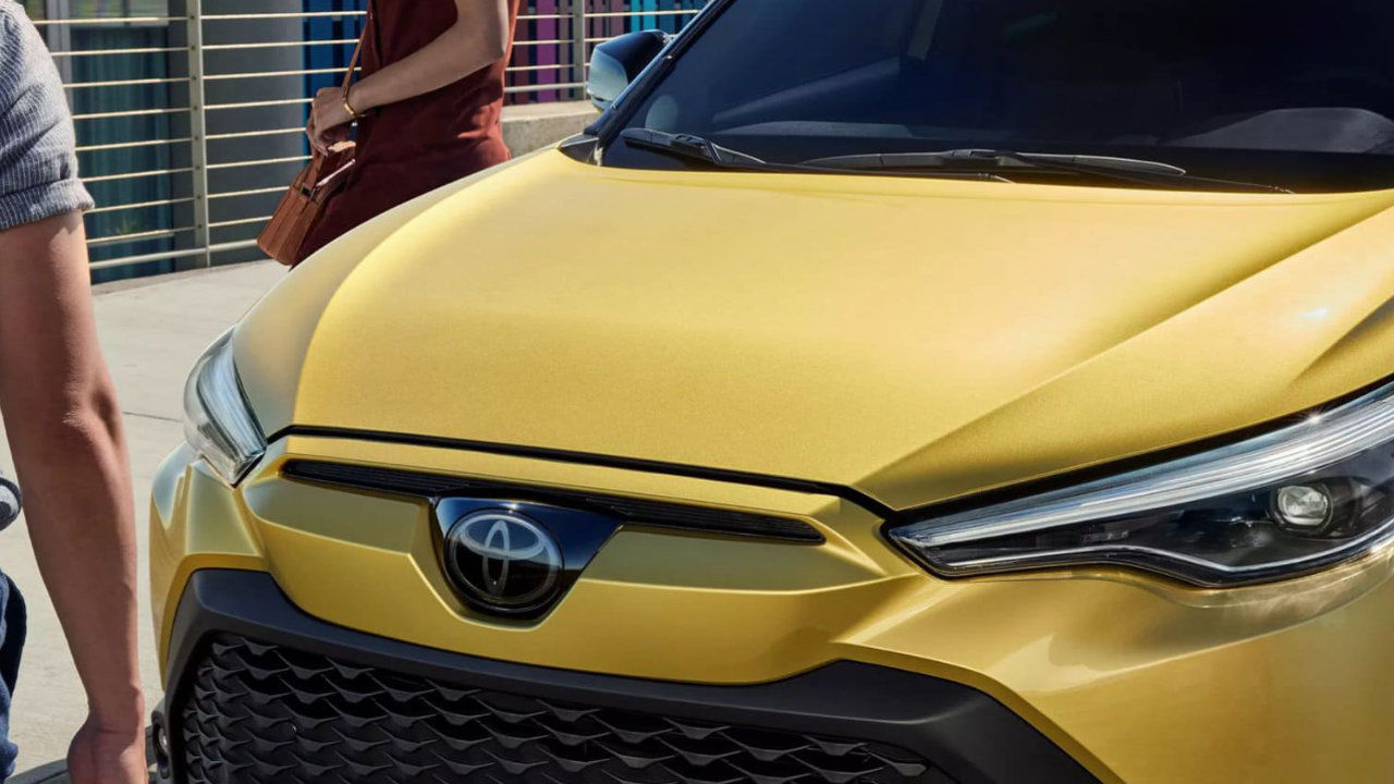 zoomed in view of the hood of a 2023 Toyota Corolla Cross hybrid