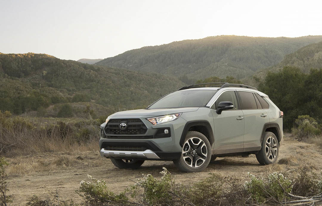 three quarter front view of the 2021 Toyota RAV4 parked on a trail