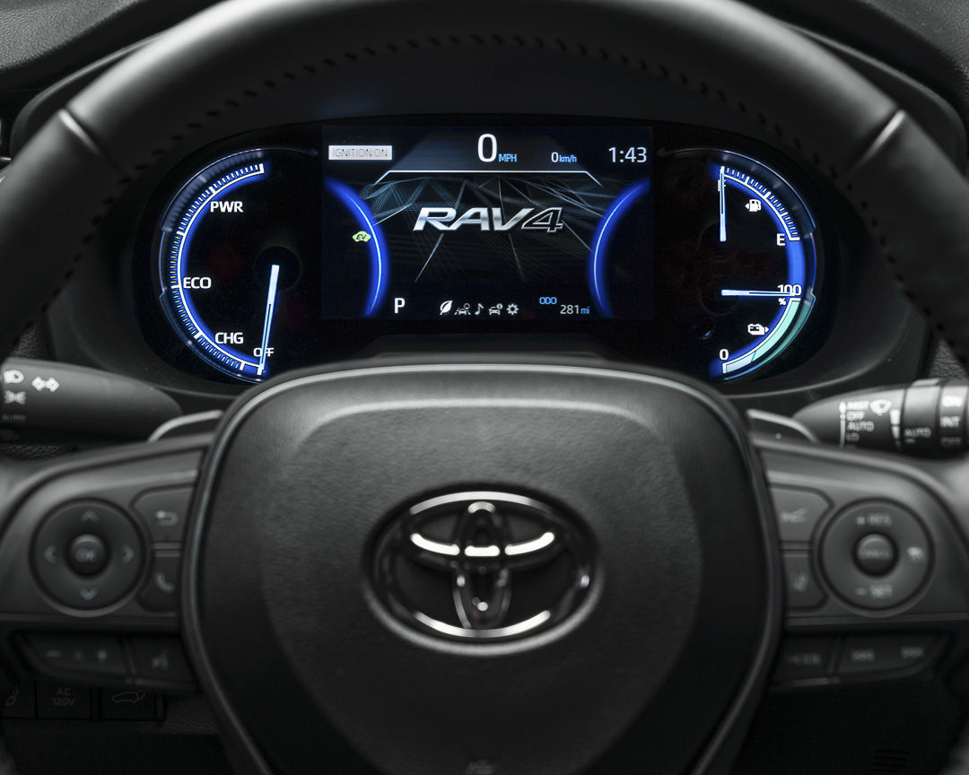 close up view of the steering wheel and digital driver dashboard of the 2022 Toyota RAV4