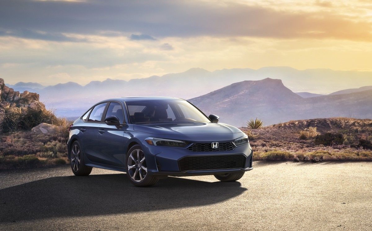 2025 Honda Civic Hybrid - Car parked with mountain view in the background