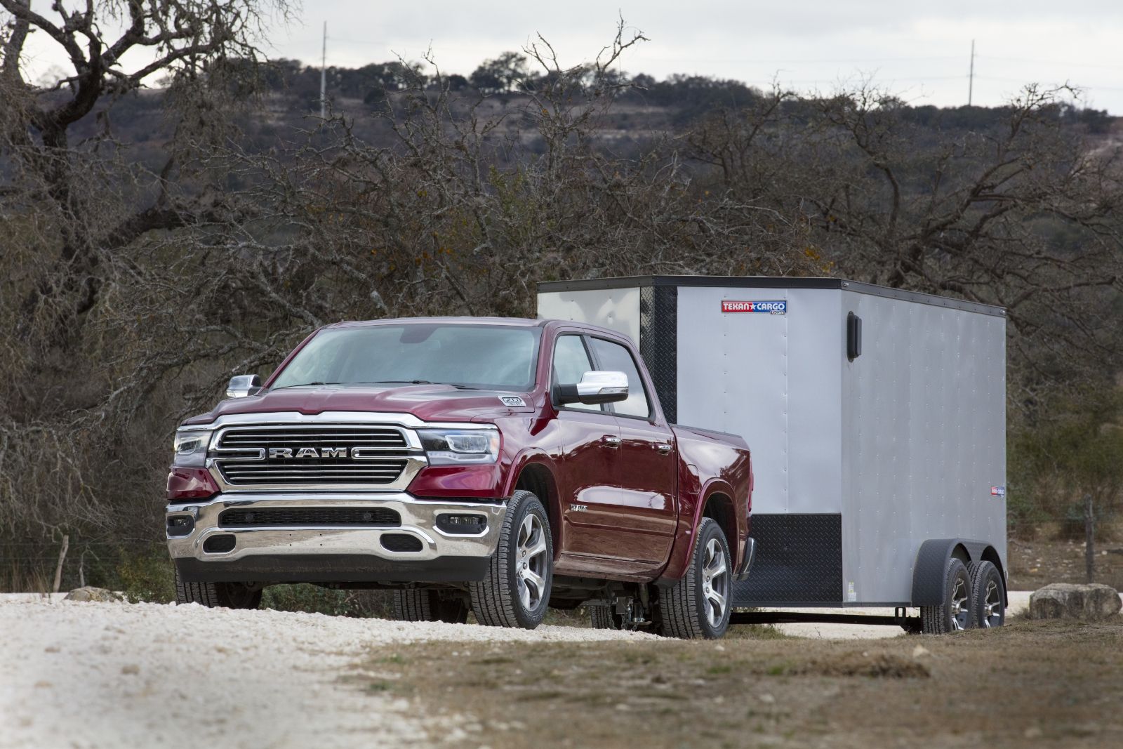 2019 Ram 1500 - a red Ram 1500 towing a trailer - AutoPark Brampton - A pre-owned car dealership in Brampton Ontario