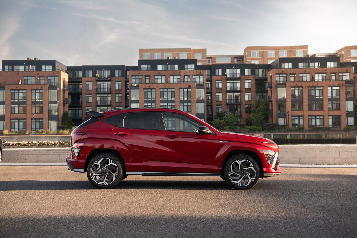 2025 Hyundai Kona - side profile view of a red 2025 Hyundai Kona N Line - Cooksville Hyundai - Hyundai car dealership in Mississauga, Ontario