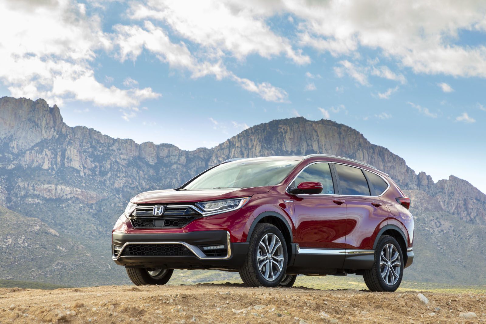 2020 Honda CR-V - a red 2020 Honda CR-V parked next to a mountain - AutoPark Barrie pre-owned car dealer in Innisfil, Ontario
