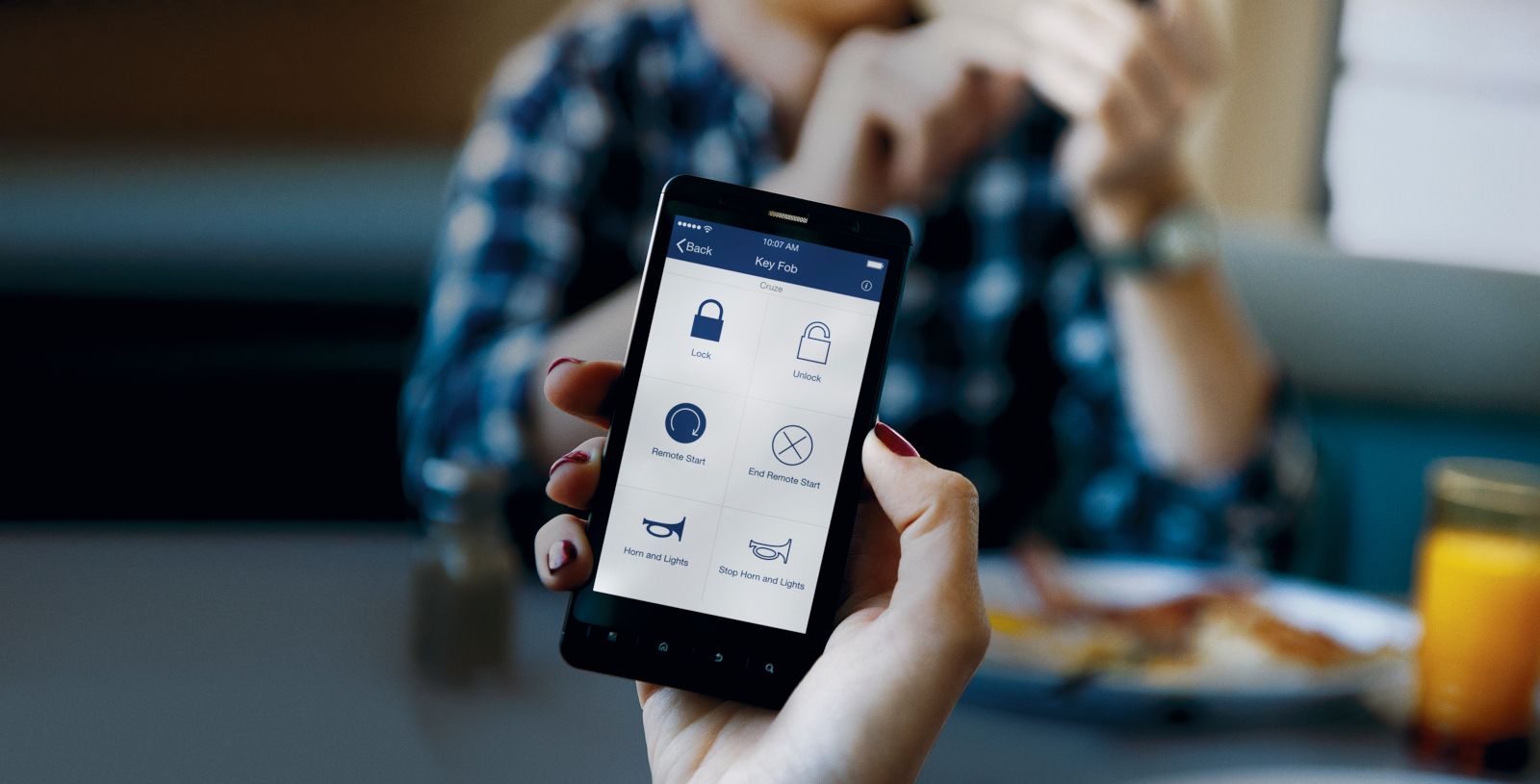 A smartphone displaying the myChevrolet app's remote key fob features - Humberview Chevrolet Buick GMC - Chevrolet car dealership in Toronto, Ontario
