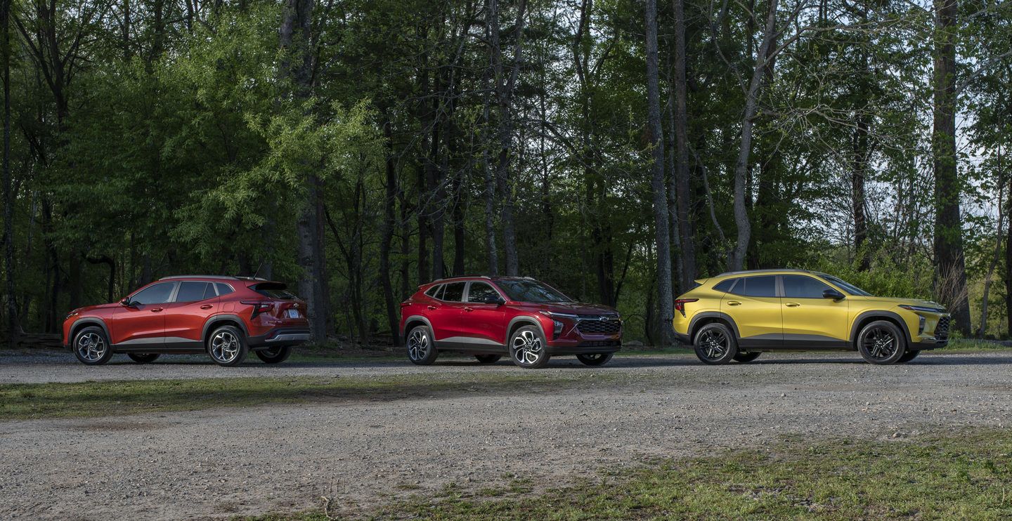 2025 Chevrolet Trax Three Chevrolet Trax SUVs in different colors parked on a gravel road - Applewood Chevrolet, Buick, GMC - new car dealerships in Ontario