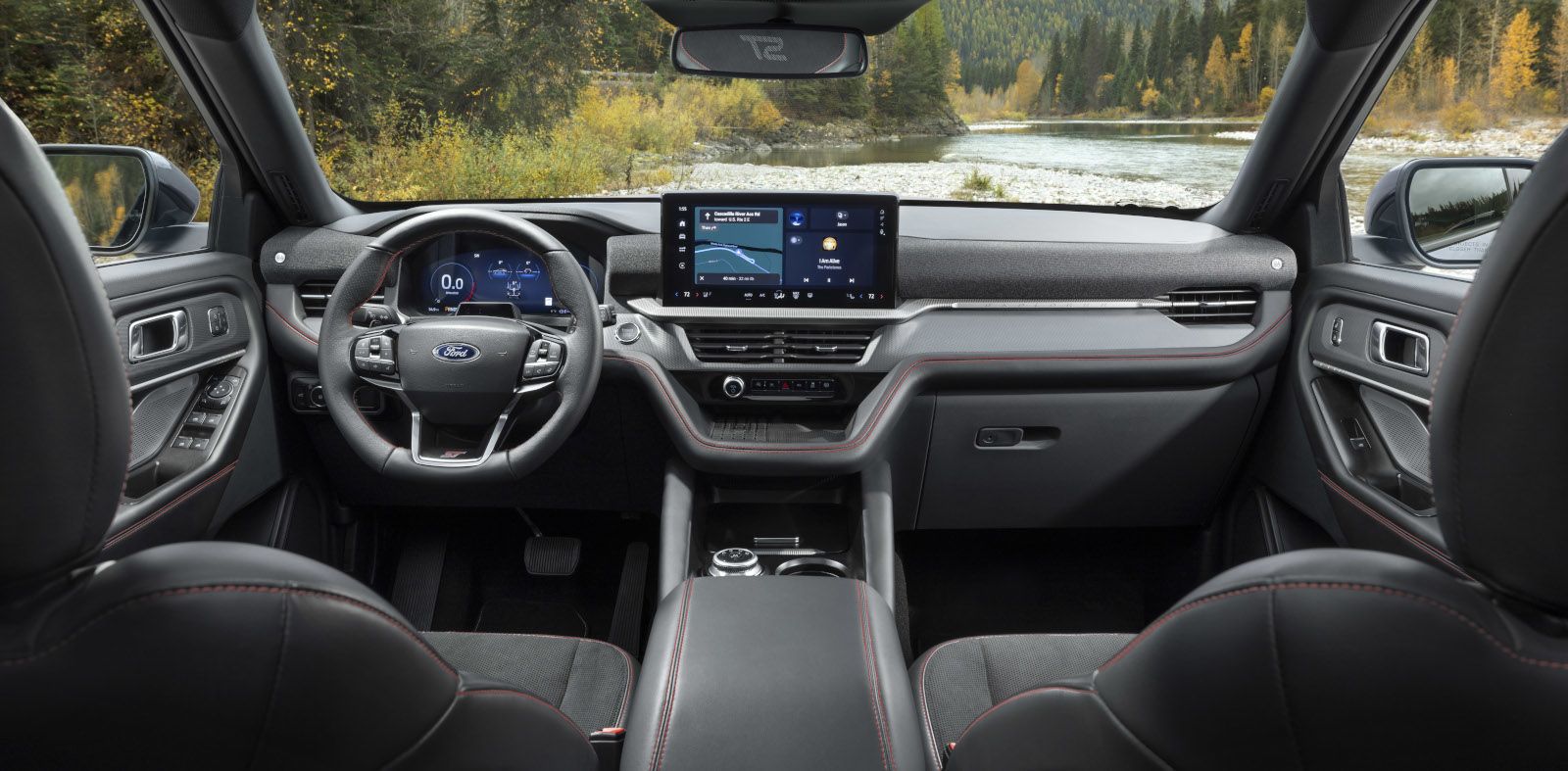 2025 Ford Explorer ST - dashboard view of the 2025 Ford Explorer ST interior, highlighting the infotainment screen and red accent stitching - Bayfield Ford - Ford car dealership in Barrie, ON