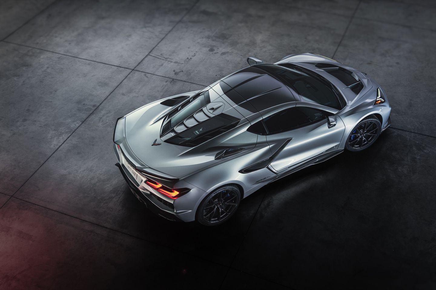 2026 Chevrolet Corvette ZR1 elevated rear-three-quarter view of a silver coupe showcasing the rear design - Applewood Chevrolet Buick GMC - New car dealership in Mississauga, Ontario