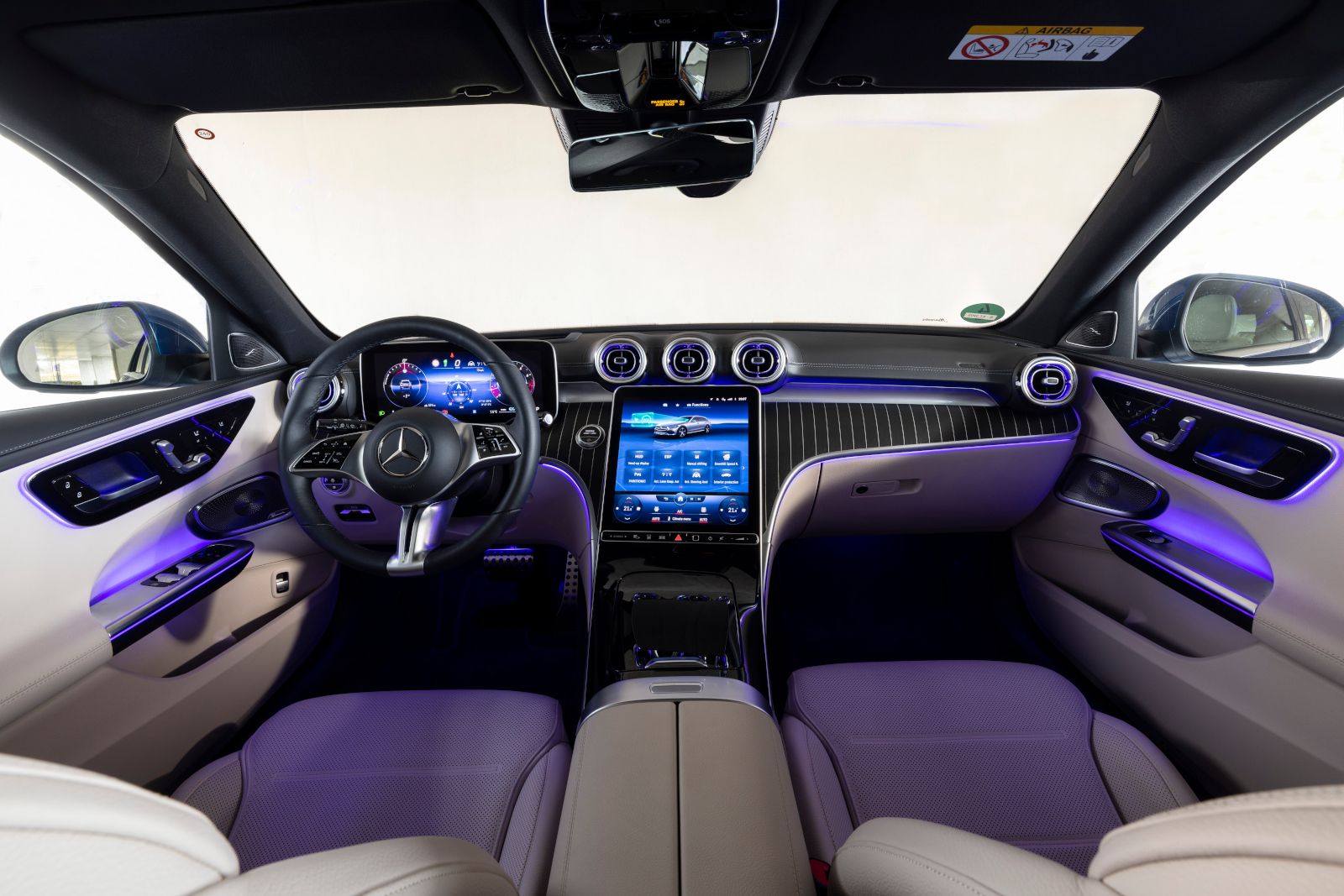 2025 Mercedes-Benz C-Class - Interior view of the dashboard, infotainment screen, and ambient lighting - Mercedes-Benz Brampton - New car dealership in Toronto, Ontario