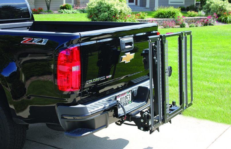 Chevrolet Colorado - a wheelchair and scooter lift attached to the rear hitch of a black Chevrolet Colorado - Courtland Mobility - Accessible vehicle dealership in Burlington, Ontario